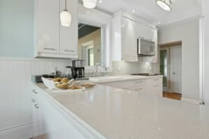 Kitchen with white cabinets and a clear countertop