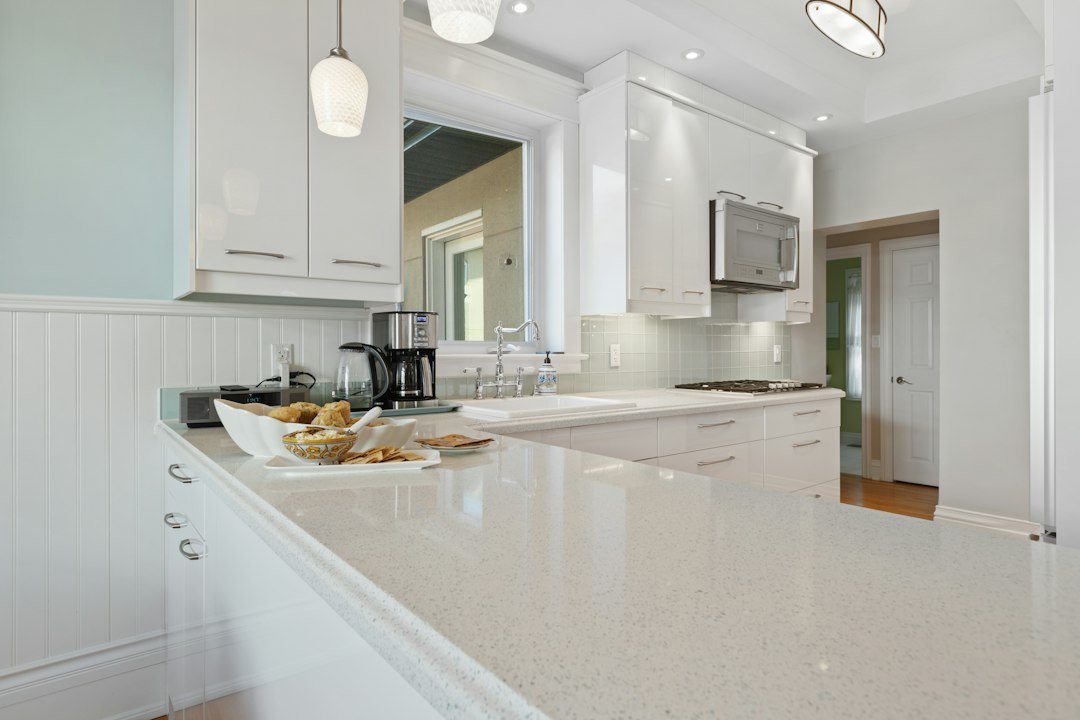 Kitchen with white cabinets and a clear countertop